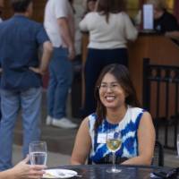 faculty enjoy a beverage outside
